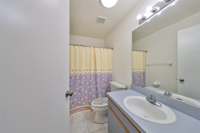 bathroom featuring toilet, vanity, tile patterned floors, and curtained shower