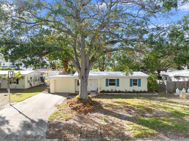 view of front facade featuring a garage and a front lawn