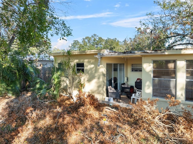 back of property with a patio