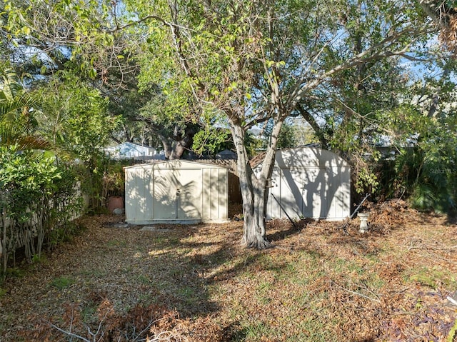 view of property exterior with a storage shed