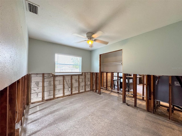 unfurnished room featuring carpet and ceiling fan