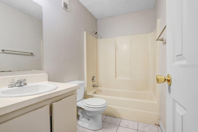 full bathroom with tile patterned flooring, a textured ceiling, toilet, vanity, and shower / bathtub combination