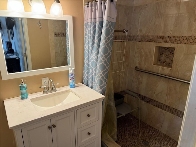 bathroom featuring vanity and curtained shower