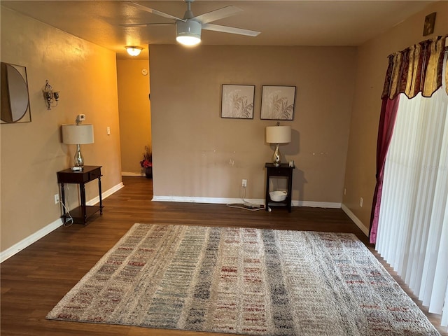 interior space featuring ceiling fan and dark hardwood / wood-style flooring