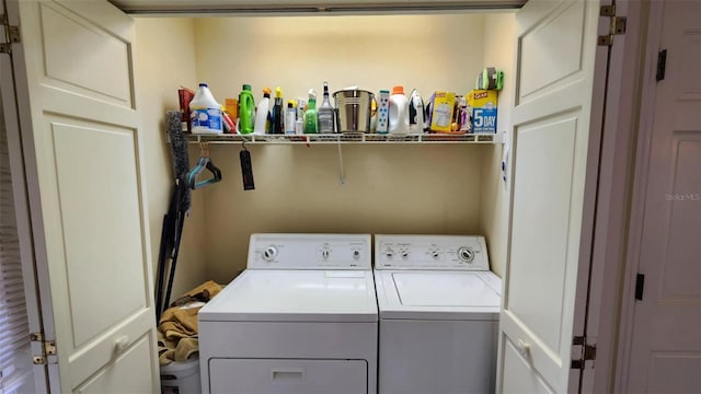 laundry room with separate washer and dryer