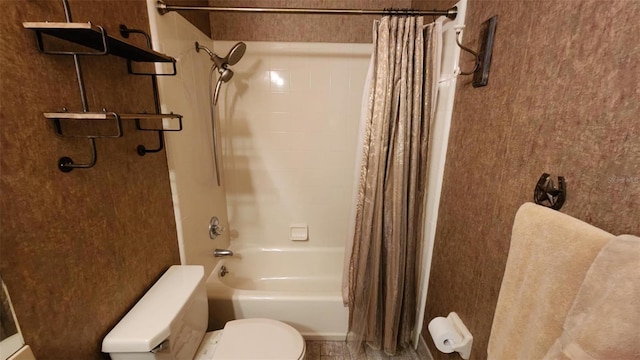 bathroom with shower / bath combination with curtain and toilet