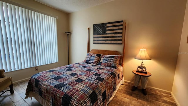 bedroom featuring wood-type flooring