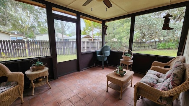 sunroom with ceiling fan and plenty of natural light