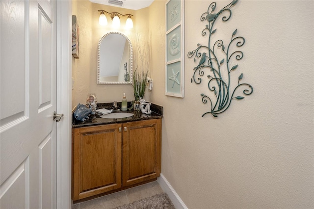 bathroom with tile patterned floors and vanity