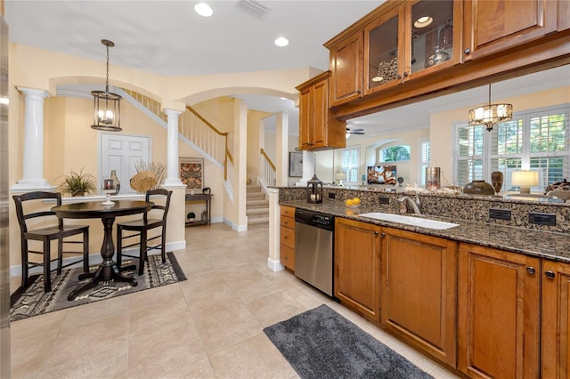 kitchen with dishwasher, hanging light fixtures, a notable chandelier, and sink