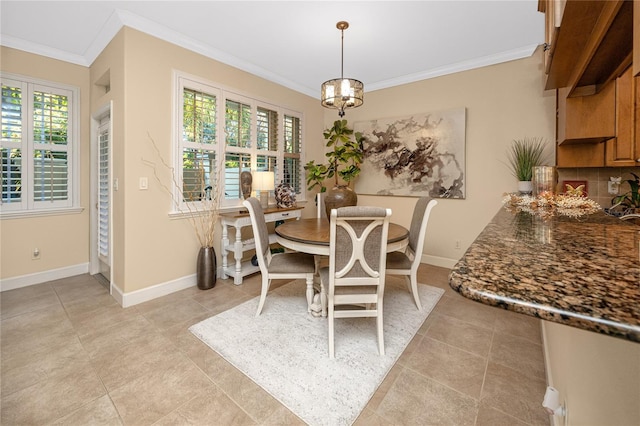 dining area featuring an inviting chandelier and crown molding