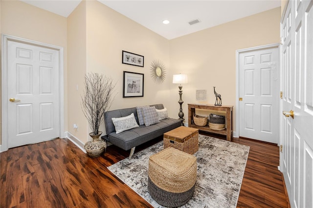 living area with dark hardwood / wood-style flooring