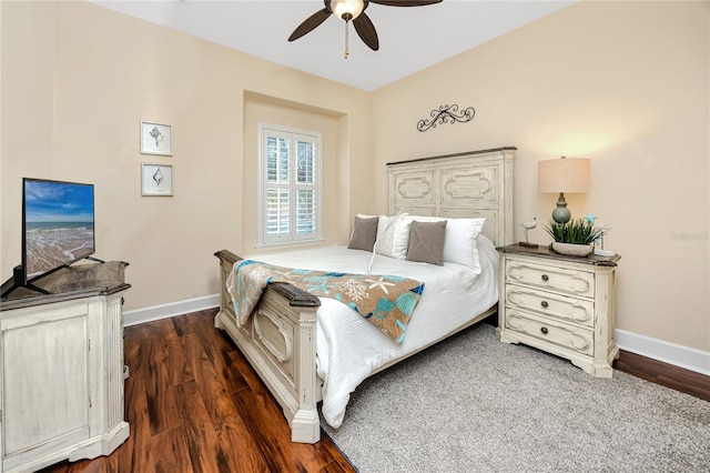 bedroom with ceiling fan and dark hardwood / wood-style floors