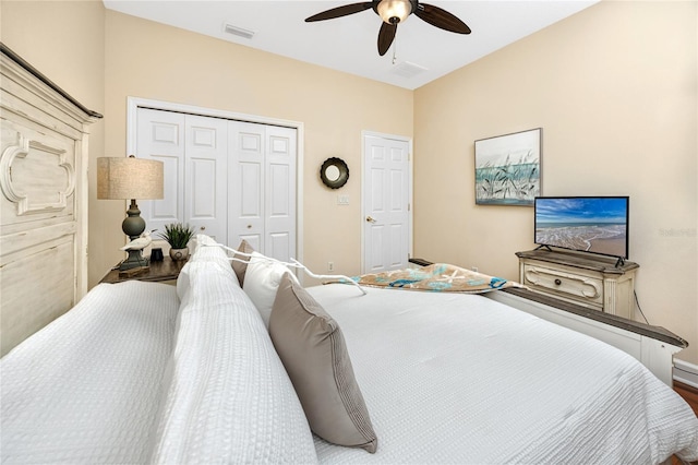 bedroom with ceiling fan and a closet