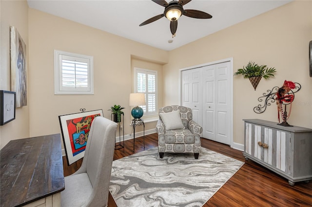 home office featuring ceiling fan and dark wood-type flooring