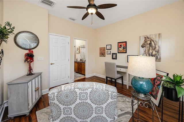 office space with ceiling fan and dark hardwood / wood-style floors