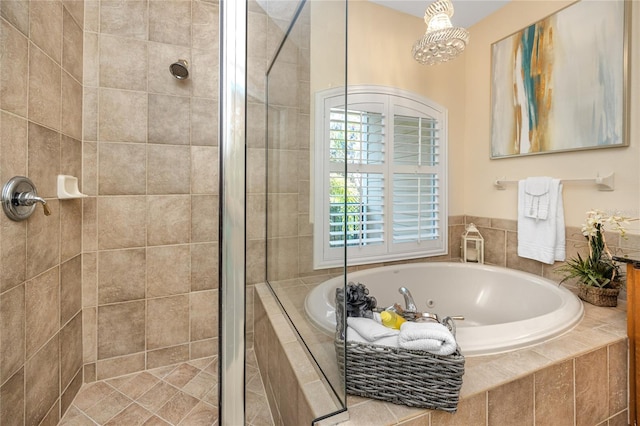 bathroom featuring shower with separate bathtub