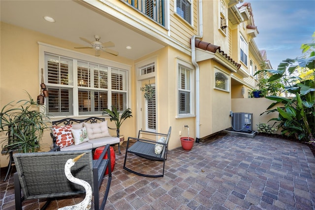 view of patio with central AC unit, ceiling fan, and outdoor lounge area