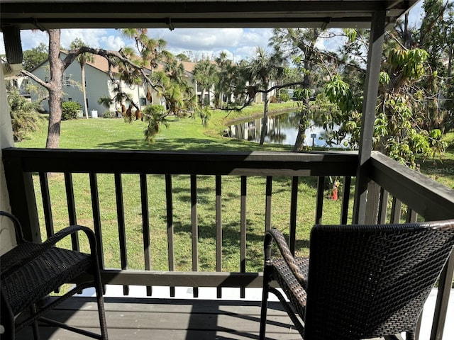 balcony featuring a water view