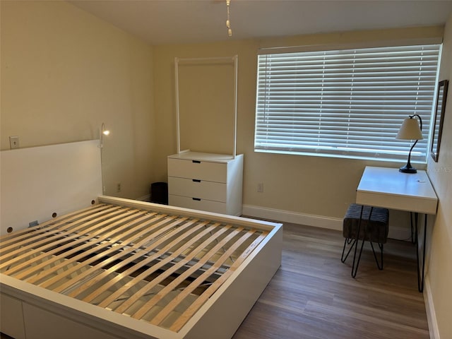 bedroom featuring dark hardwood / wood-style floors