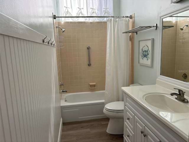 full bathroom with vanity, toilet, wood-type flooring, and shower / tub combo