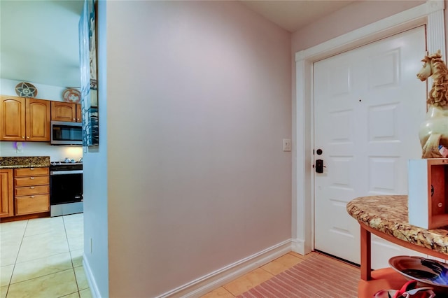 entryway with light tile patterned floors