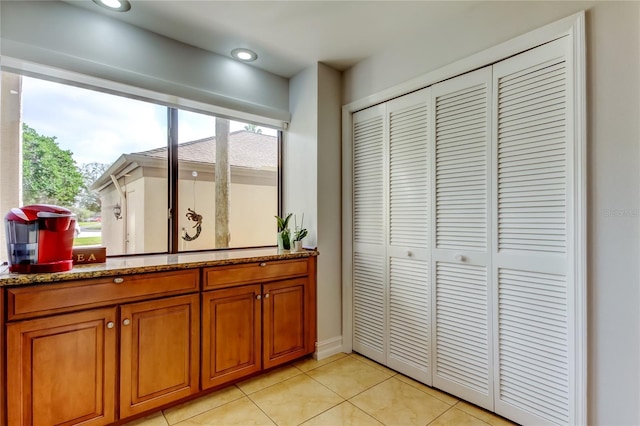 bathroom with tile patterned flooring and vanity