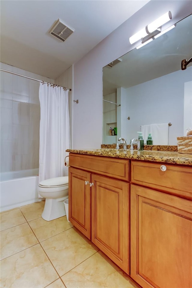 full bathroom featuring tile patterned floors, vanity, toilet, and shower / bath combo