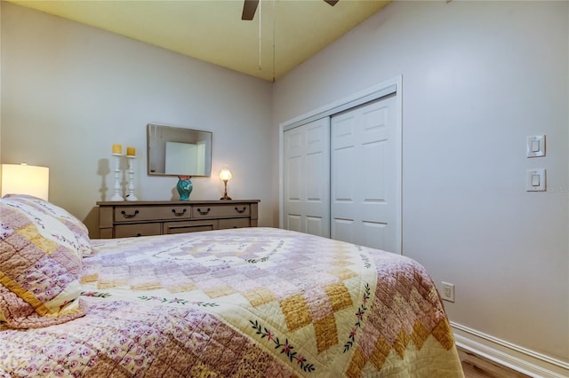 bedroom featuring hardwood / wood-style floors, a closet, and ceiling fan