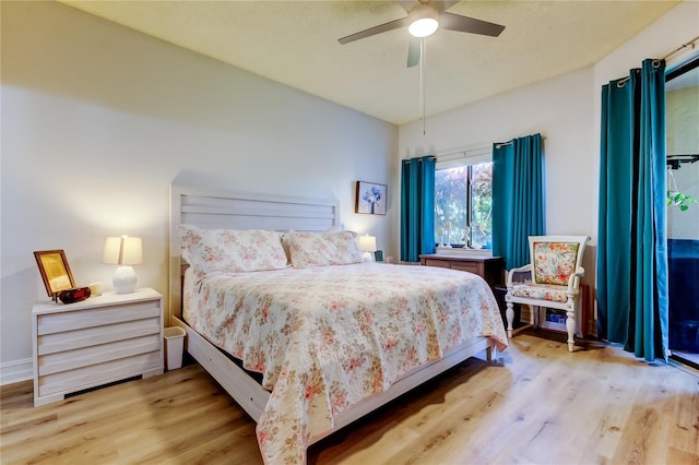 bedroom with ceiling fan and light hardwood / wood-style floors