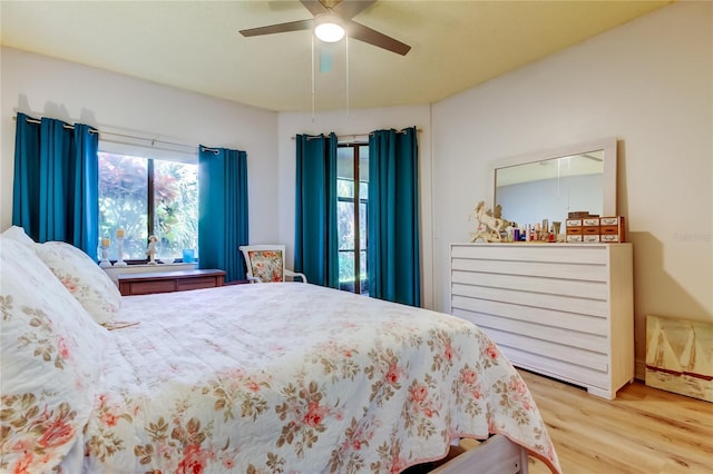 bedroom with wood-type flooring and ceiling fan