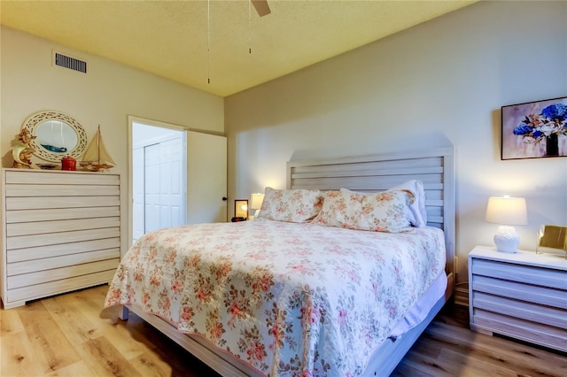 bedroom featuring ceiling fan and hardwood / wood-style flooring