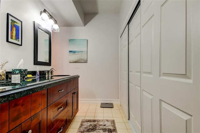 bathroom featuring tile patterned flooring and vanity