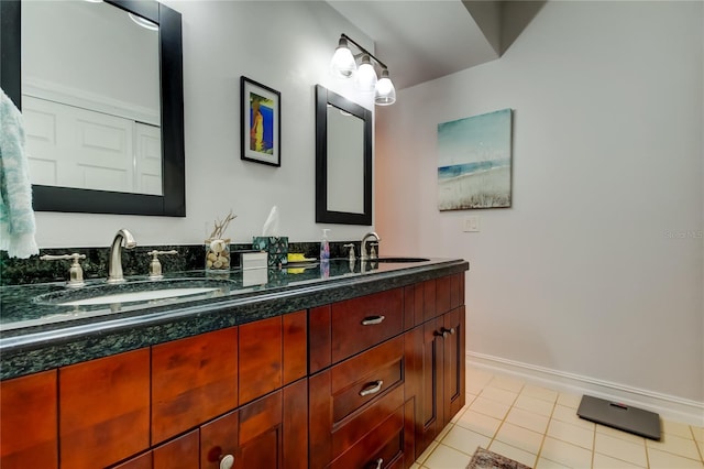 bathroom featuring tile patterned flooring and vanity