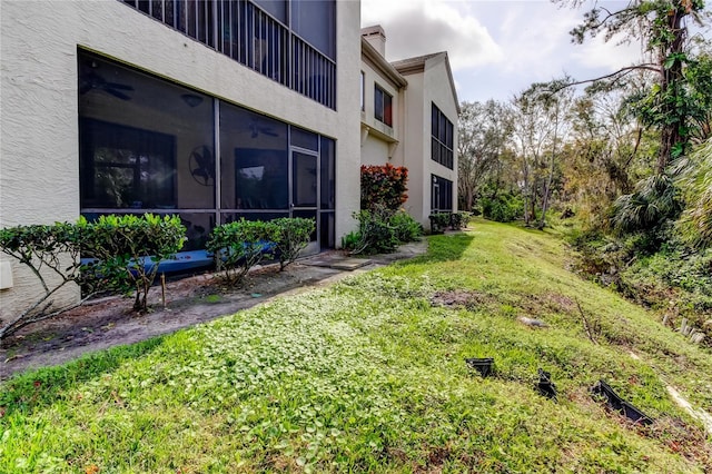 view of yard with a sunroom