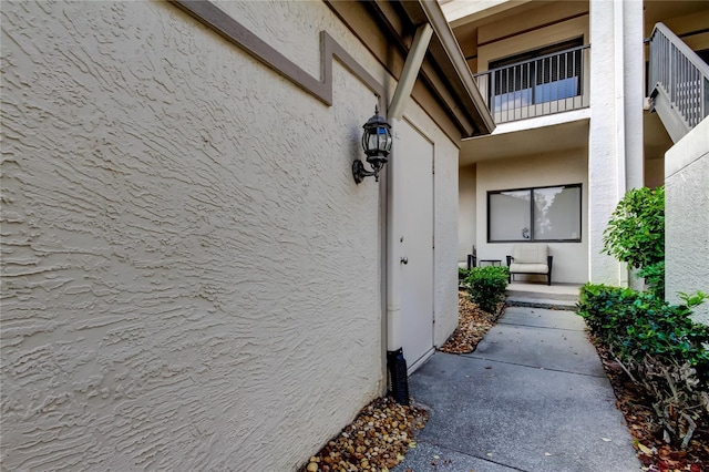 doorway to property featuring a balcony