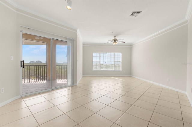 spare room with light tile patterned floors, ceiling fan, visible vents, baseboards, and ornamental molding