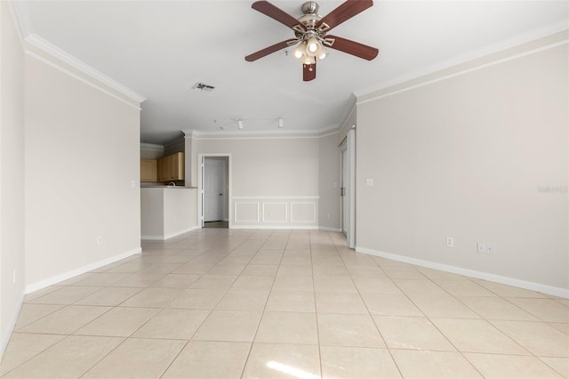 unfurnished room featuring light tile patterned floors, visible vents, baseboards, ceiling fan, and crown molding