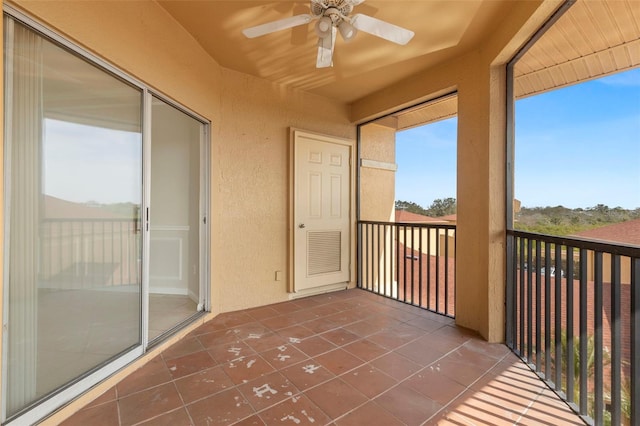 unfurnished sunroom featuring ceiling fan