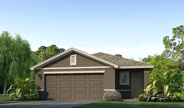 view of front of property with a front yard and a garage