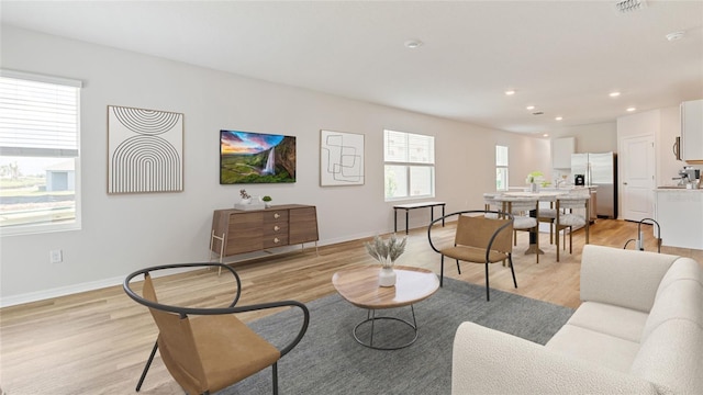 living room with light hardwood / wood-style floors