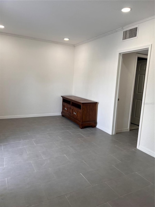 tiled empty room with ornamental molding