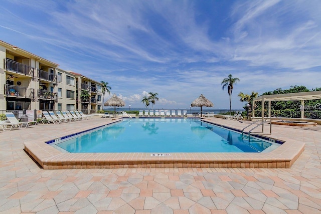 view of swimming pool with a patio area