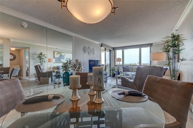 dining space with a fireplace, crown molding, floor to ceiling windows, a textured ceiling, and light hardwood / wood-style flooring