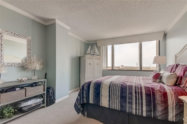 carpeted bedroom featuring ornamental molding and a textured ceiling