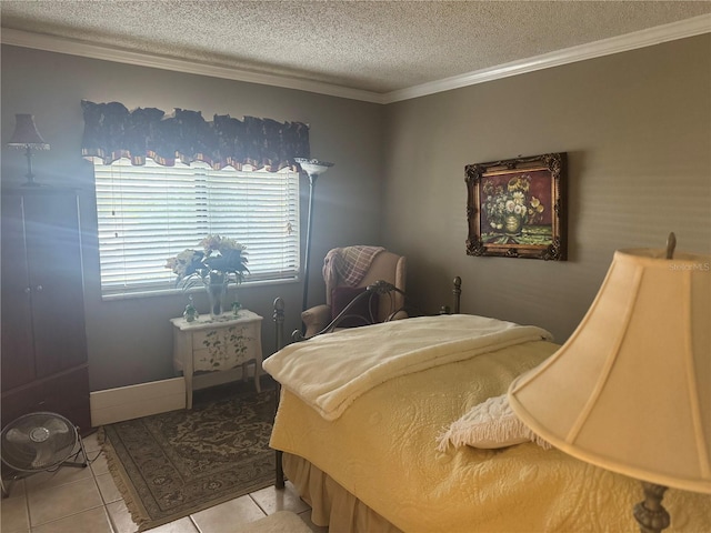 bedroom featuring light tile patterned floors, a textured ceiling, and ornamental molding