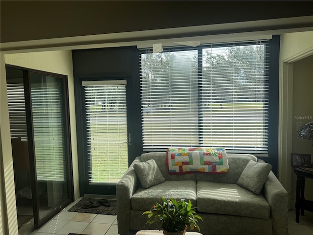 tiled living room featuring plenty of natural light