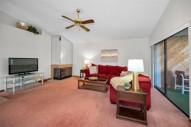 living room featuring carpet floors, vaulted ceiling, and ceiling fan