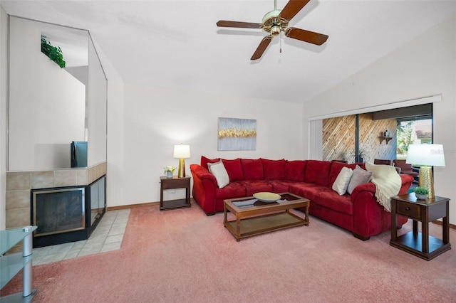 carpeted living room featuring ceiling fan, lofted ceiling, and a fireplace