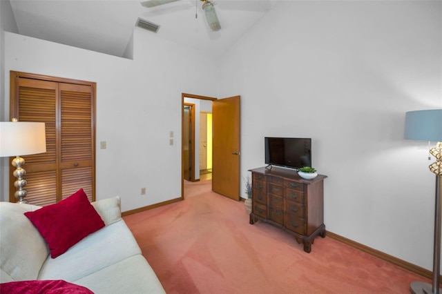 living room with carpet floors, high vaulted ceiling, and ceiling fan